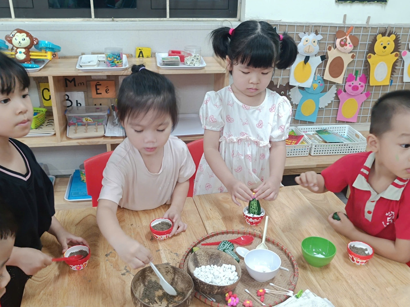 A group of children sitting at a table
AI-generated content may be incorrect.