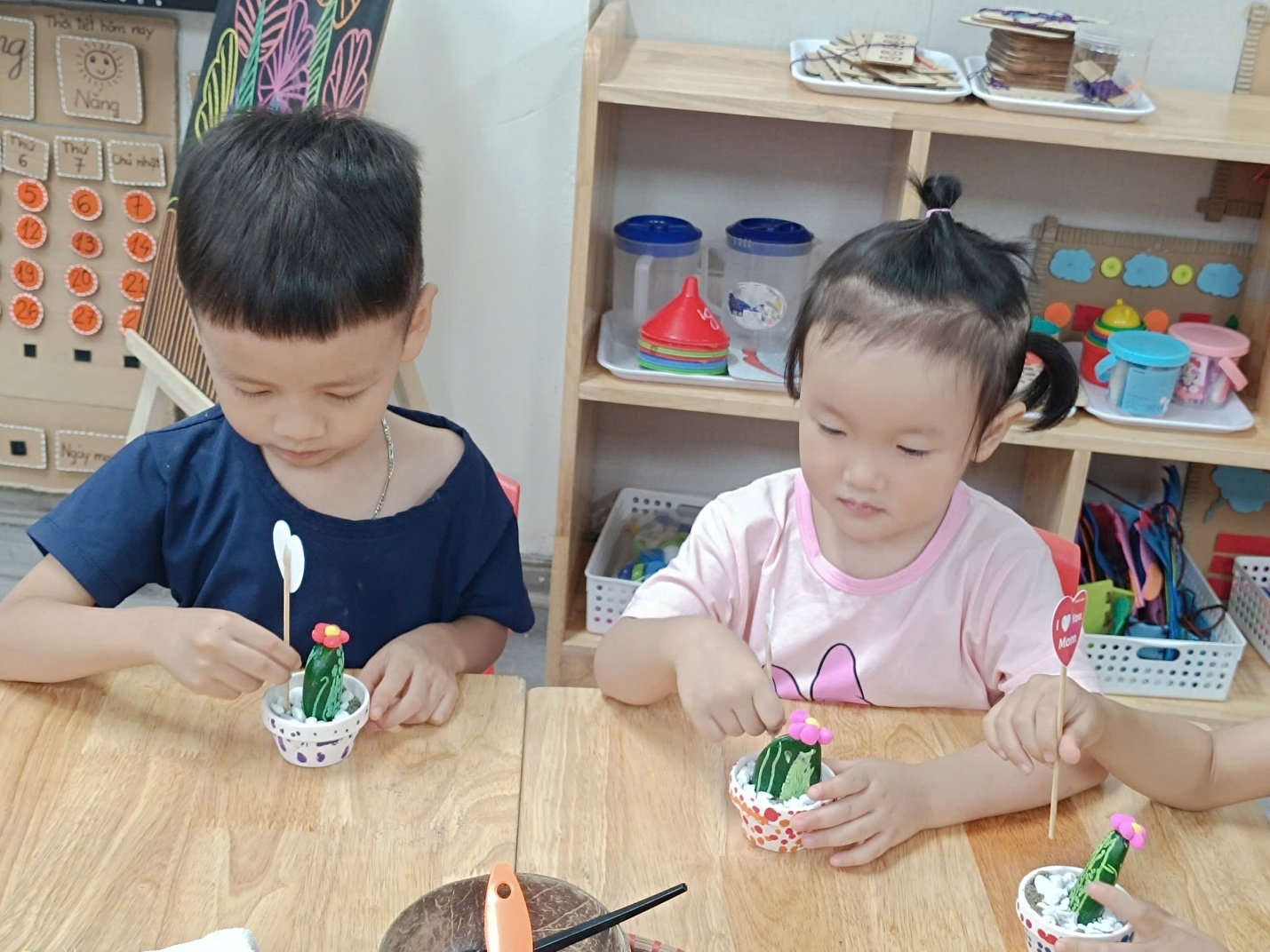 A group of children painting on a table
AI-generated content may be incorrect.