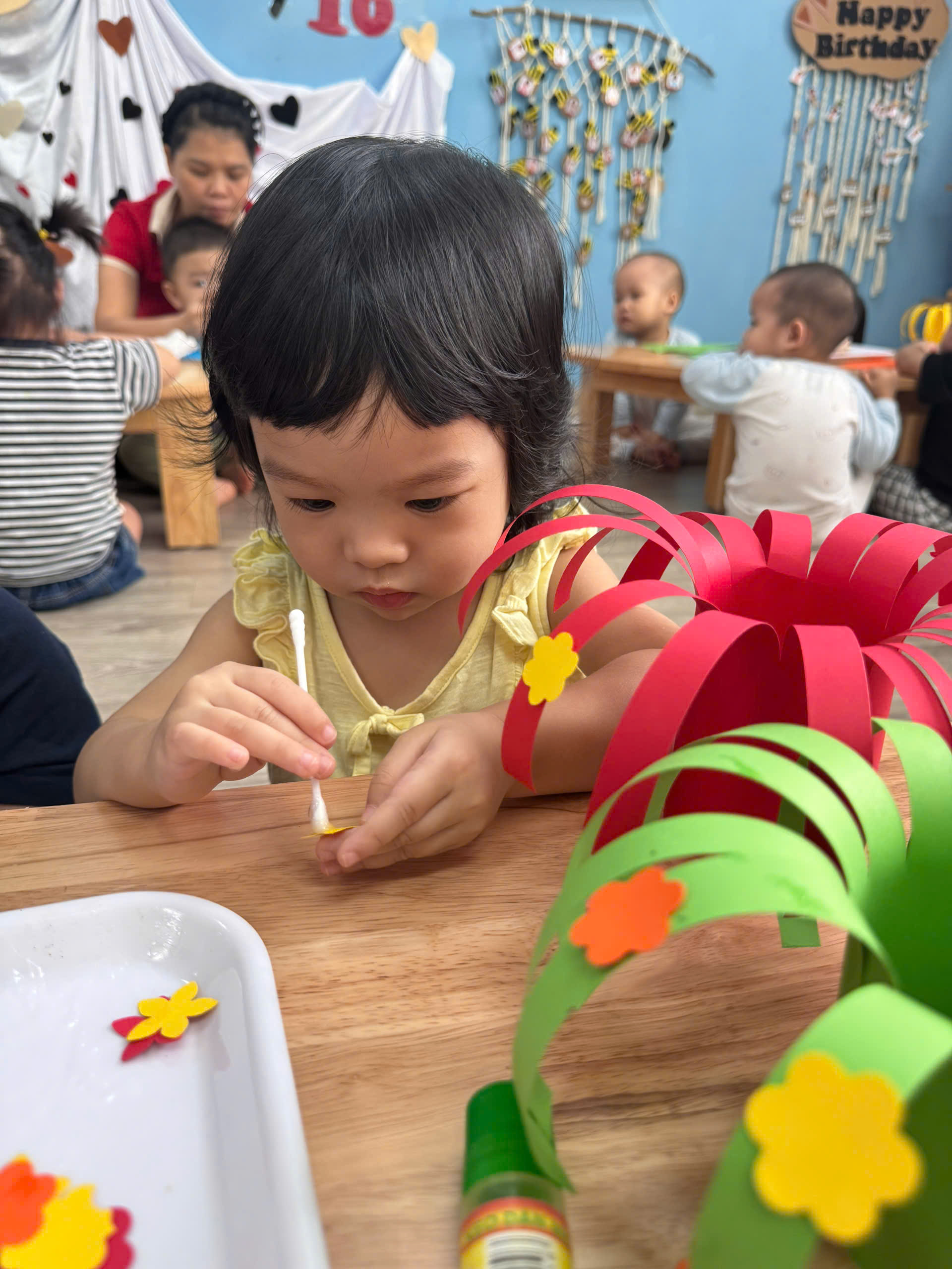 A child painting a flowerAI-generated content may be incorrect.