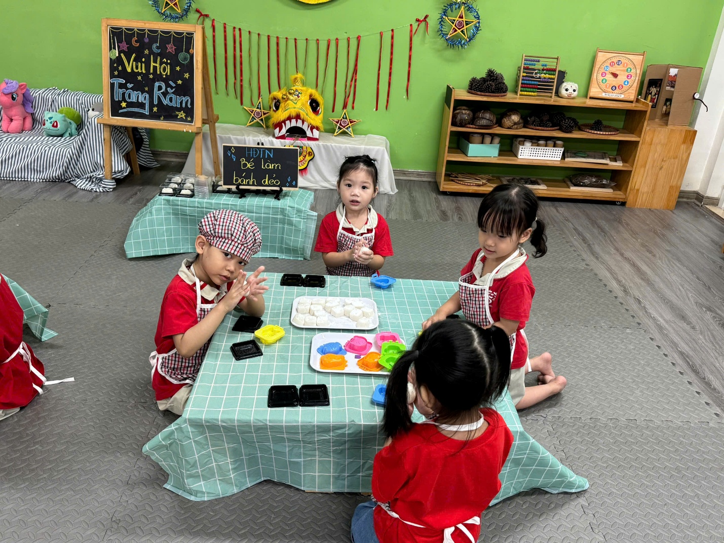 A group of children playing with a table
AI-generated content may be incorrect.