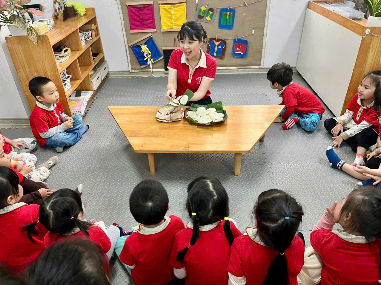A group of children sitting on the floor in a classroomAI-generated content may be incorrect.