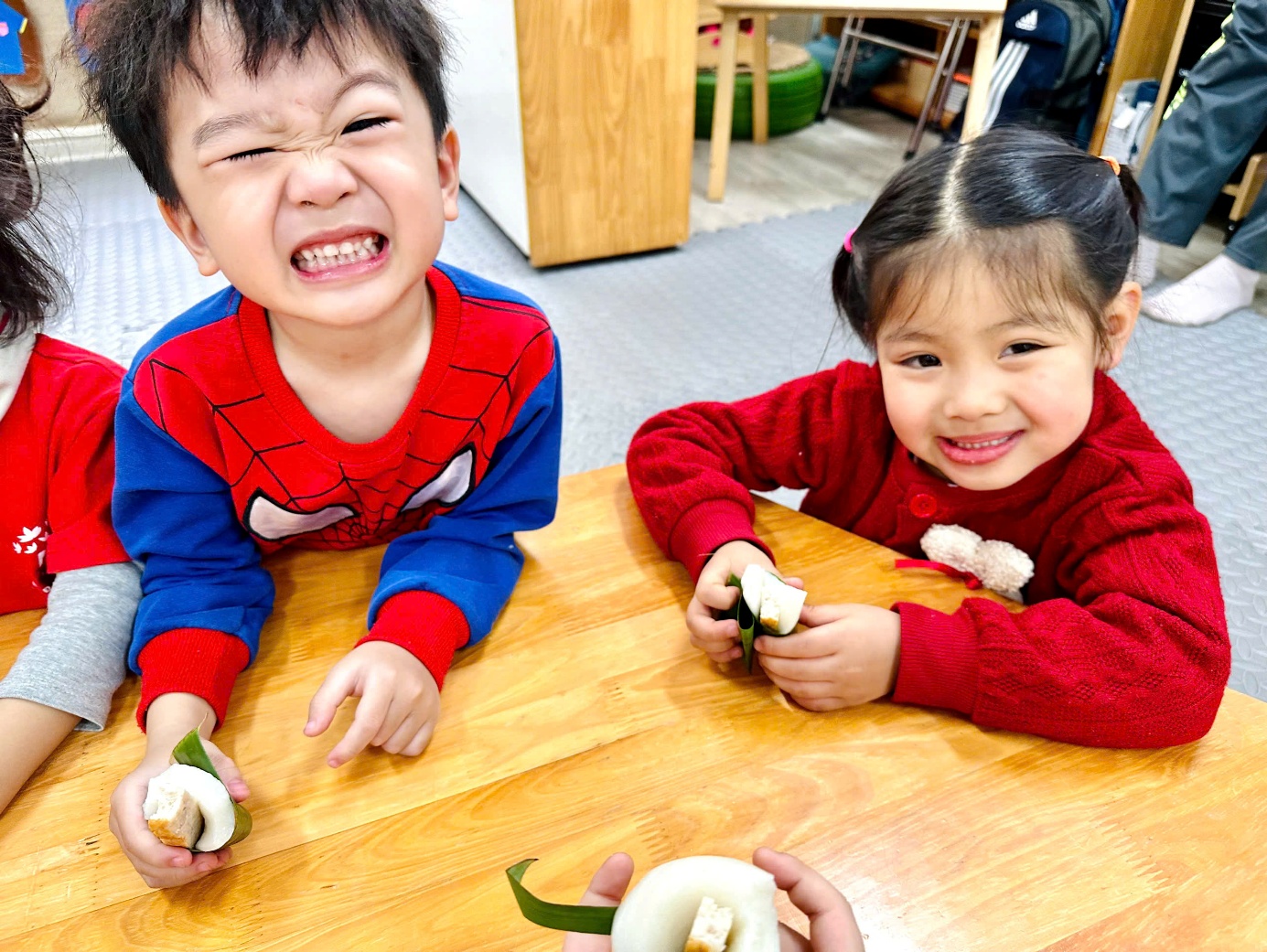 A child and child smiling at the cameraAI-generated content may be incorrect.