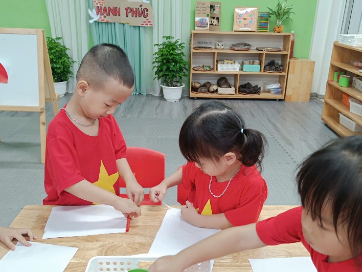 A group of children sitting at a table

AI-generated content may be incorrect.