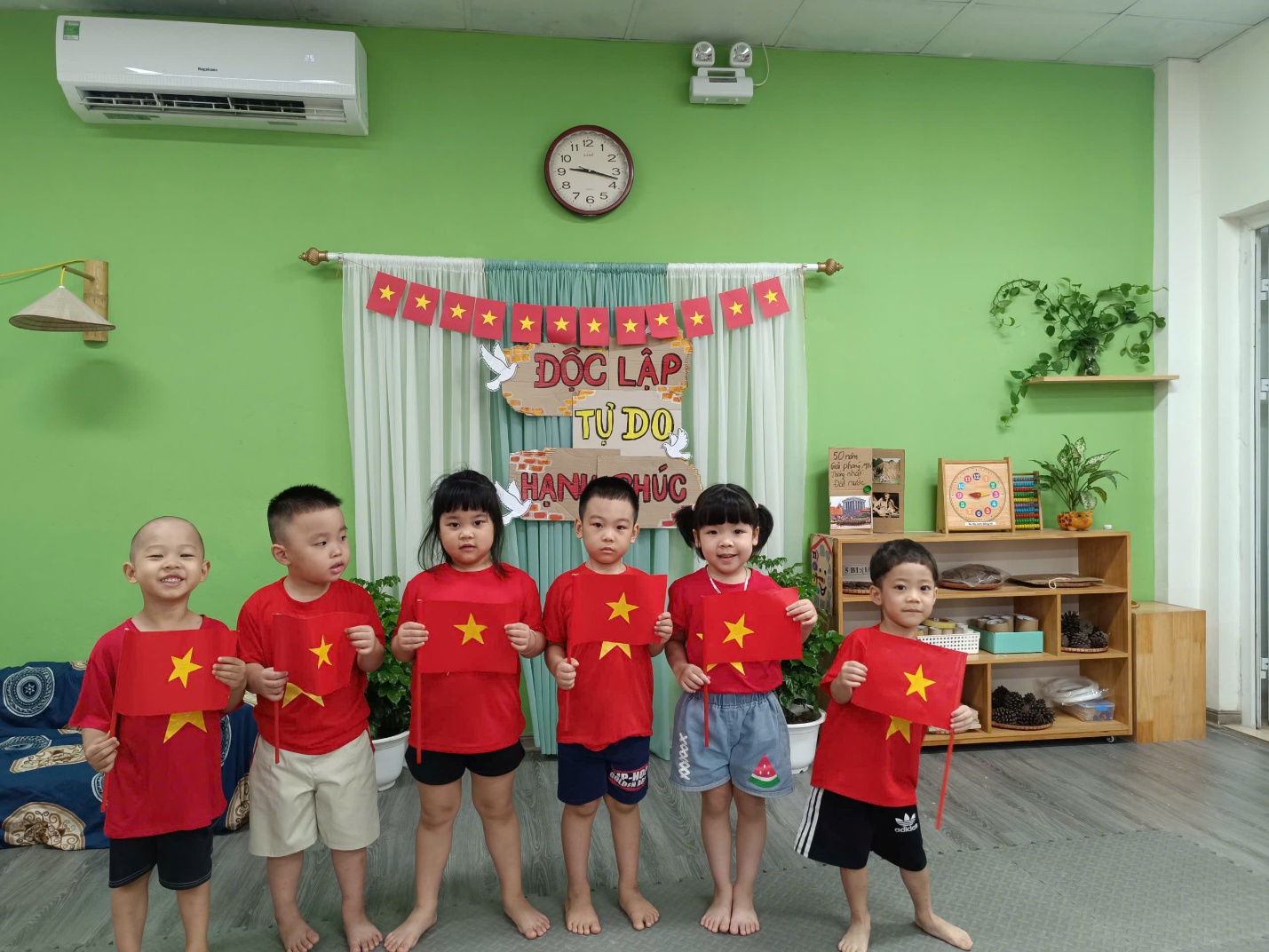 A group of children wearing red shirts

AI-generated content may be incorrect.