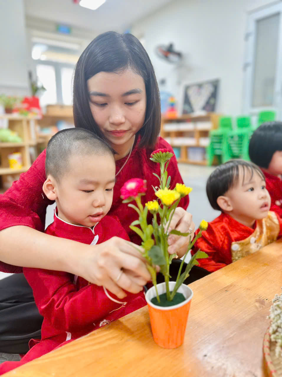 A person and a child in red shirtsAI-generated content may be incorrect.