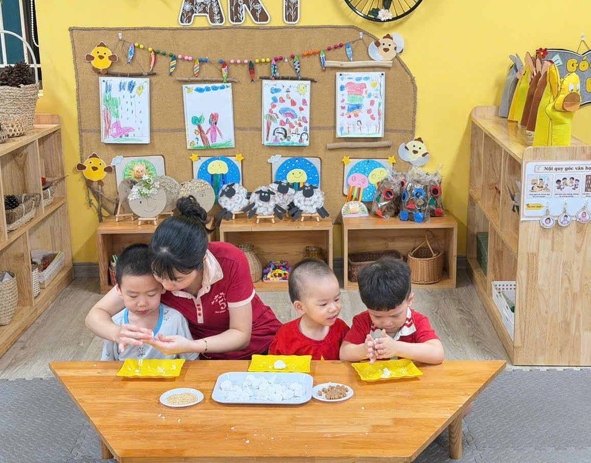 A group of kids sitting at a tableAI-generated content may be incorrect.