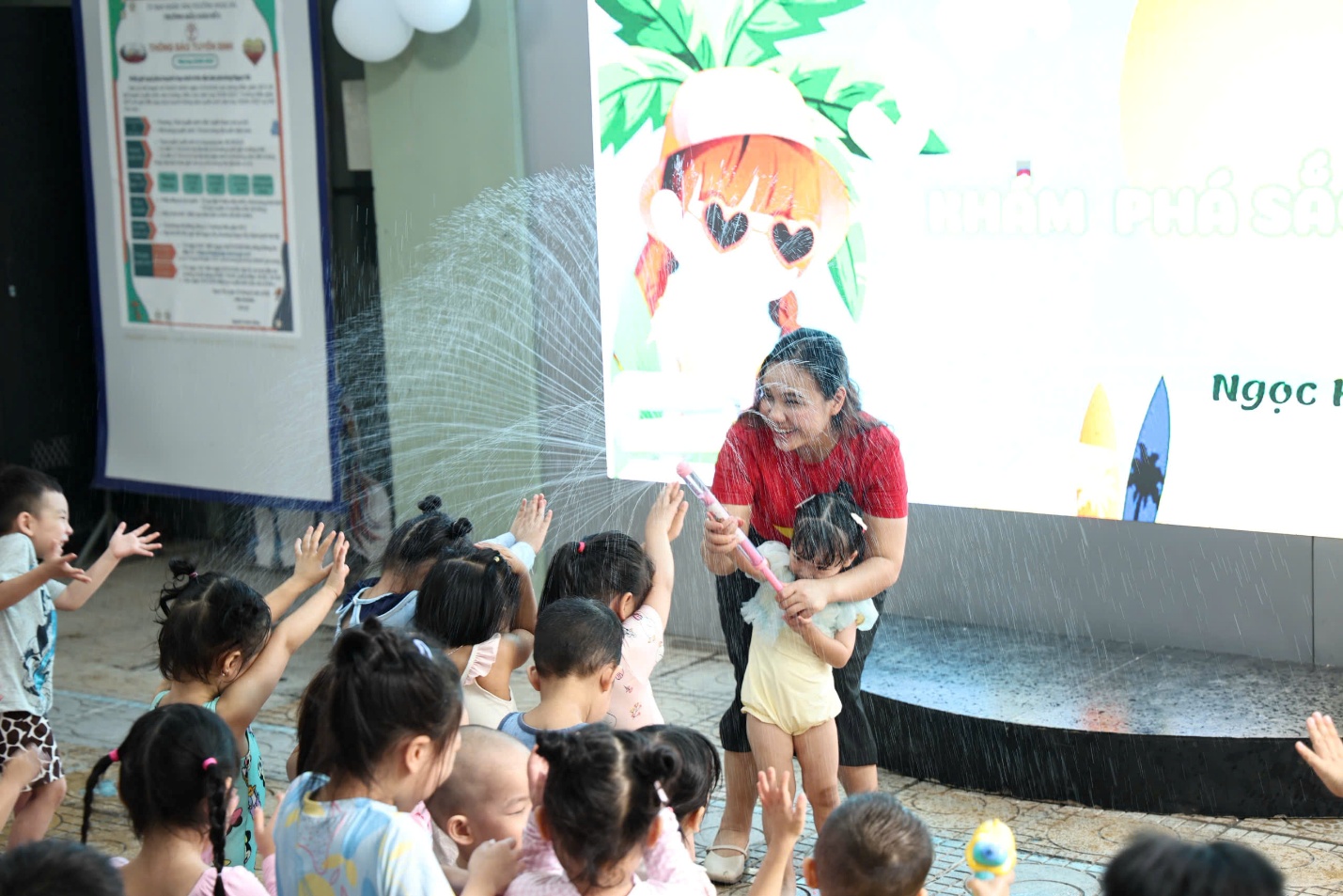A person holding a child in front of a group of childrenAI-generated content may be incorrect.